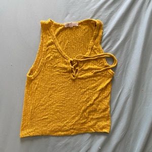 Size small, mustard colored crop top
